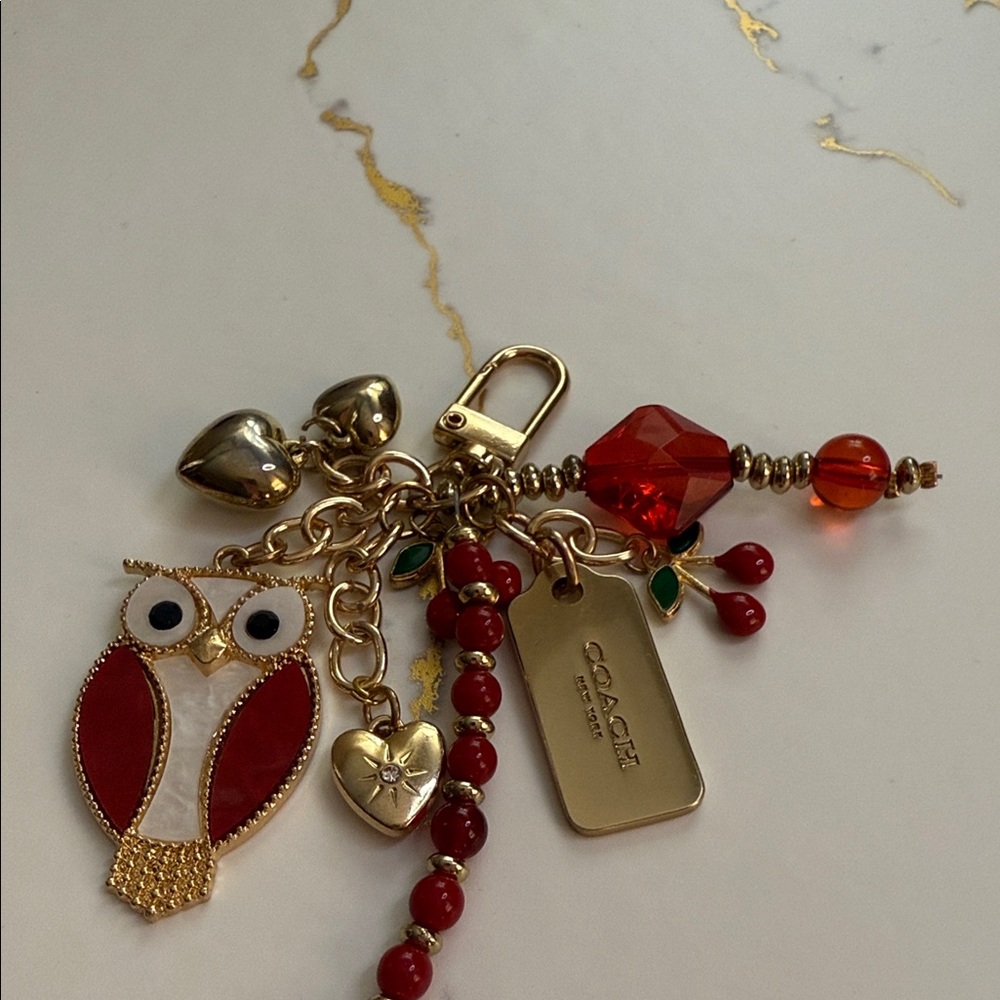 Red Owl purse charm it includes a Coach bag zipper pull